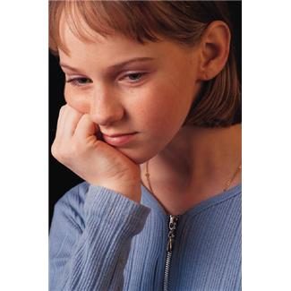 sad young adolescent girl, fist on cheek